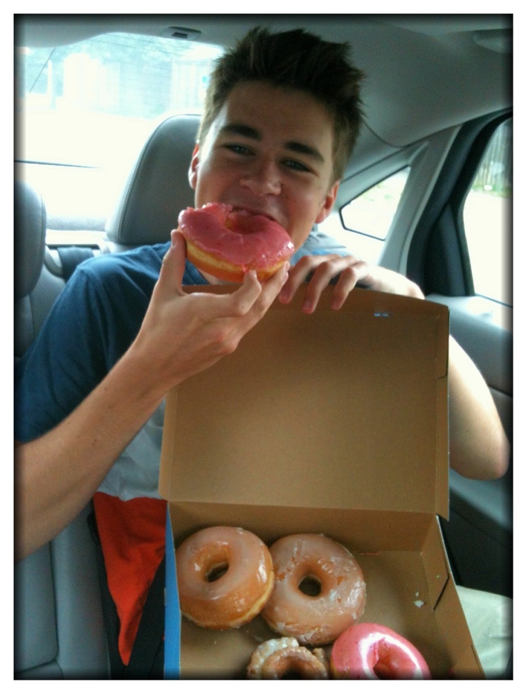 Christine, here is your boy in the car on the way home from Top Pot Doughnuts this morning. This must make you smile, yes?